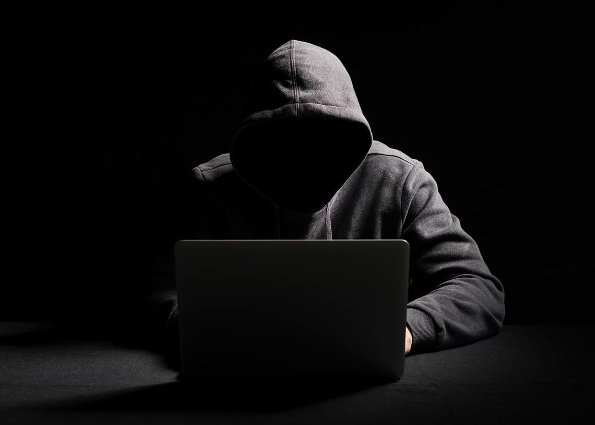 'Hooded Figure with Laptop in Dark hacker hacking' Poster, picture ...