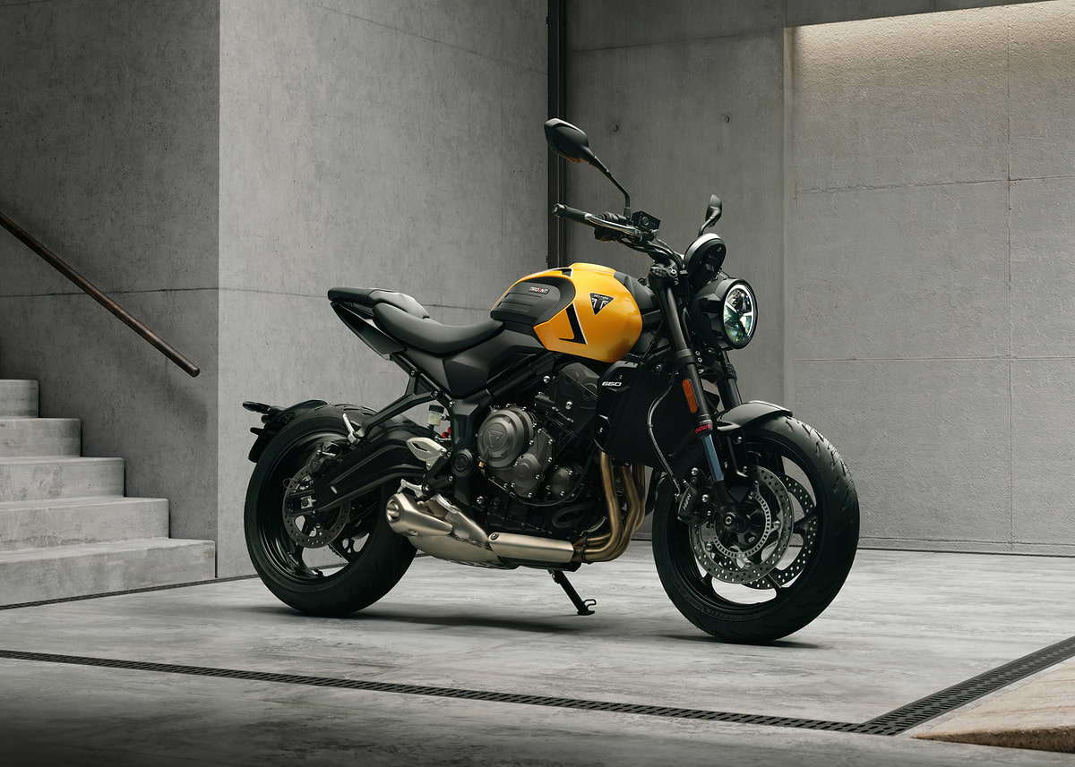 Yellowq 'Yellow Triumph Motorcycle in Modern Setting' Poster, picture, metal ...