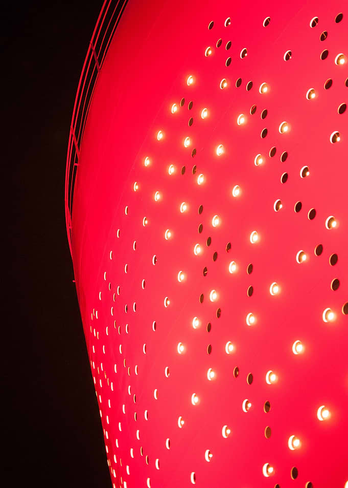 Facade of a former oil silo converted into light art pi ...