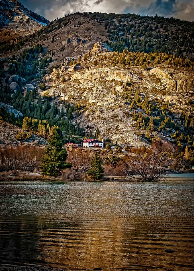 in between the mountains and the river