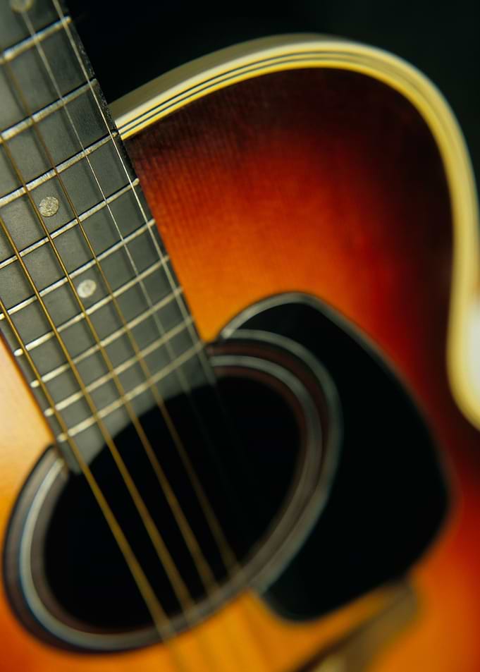 Close up of an acoustic six string Guitar