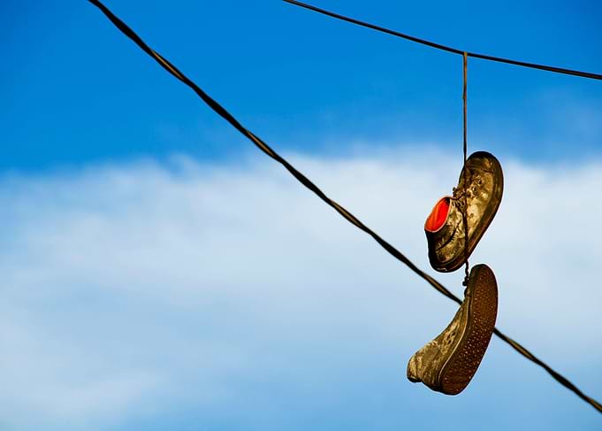 'Shoefiti' is the slang term used for the practice of s ...