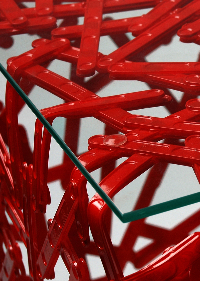 This is a table made from plastic spoons used in the co ...