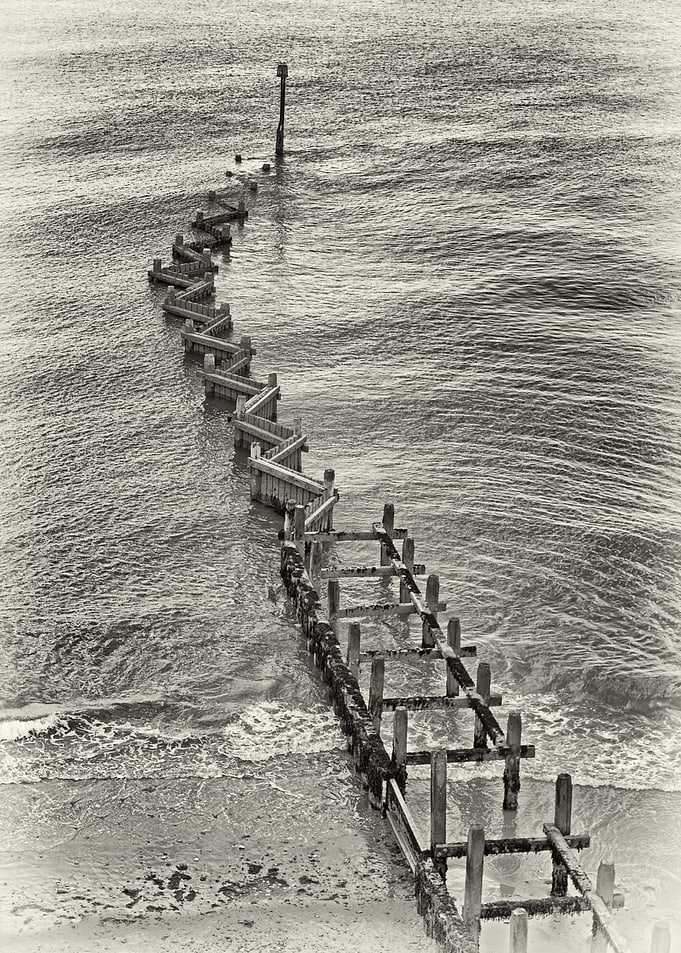 Black and white groins on the Suffolk coast.