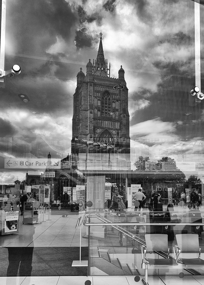 Church reflected in Forum windows, Norwich.