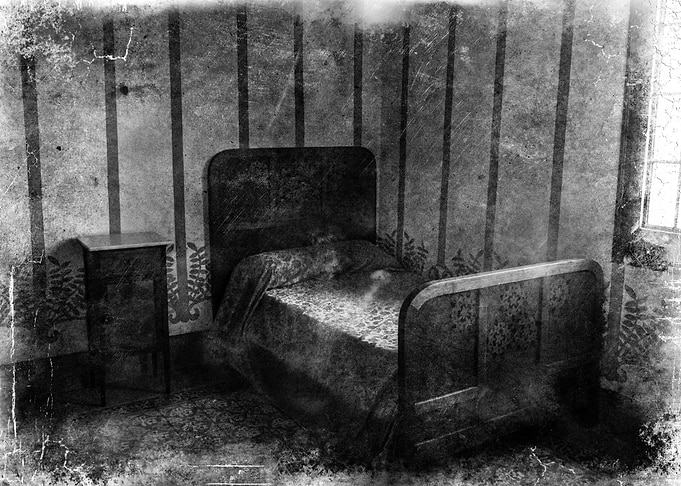 Praying for the light. View of an asylum bedroom... wit ...