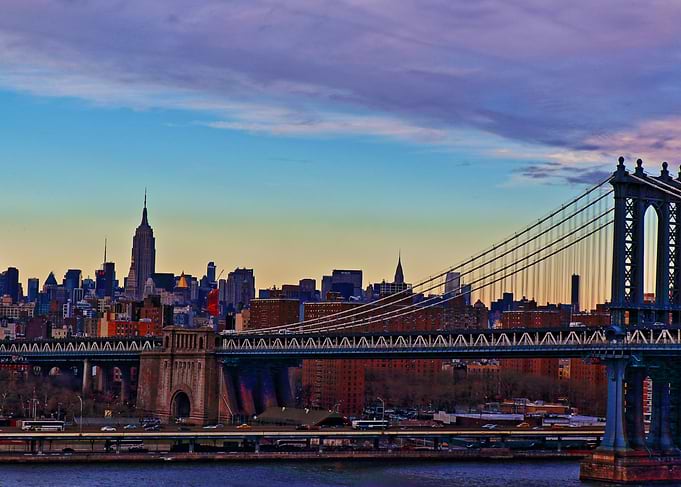 Manhattan Bridge with the Empire State Building in the ...