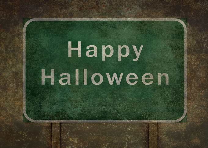 Happy Halloween Ominous Road sign, travel it if you dar ...