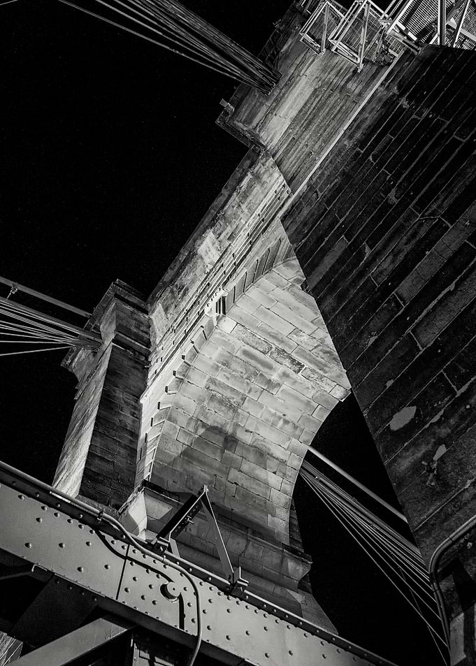 A dramatic night view of one of the arch piers of the h ...