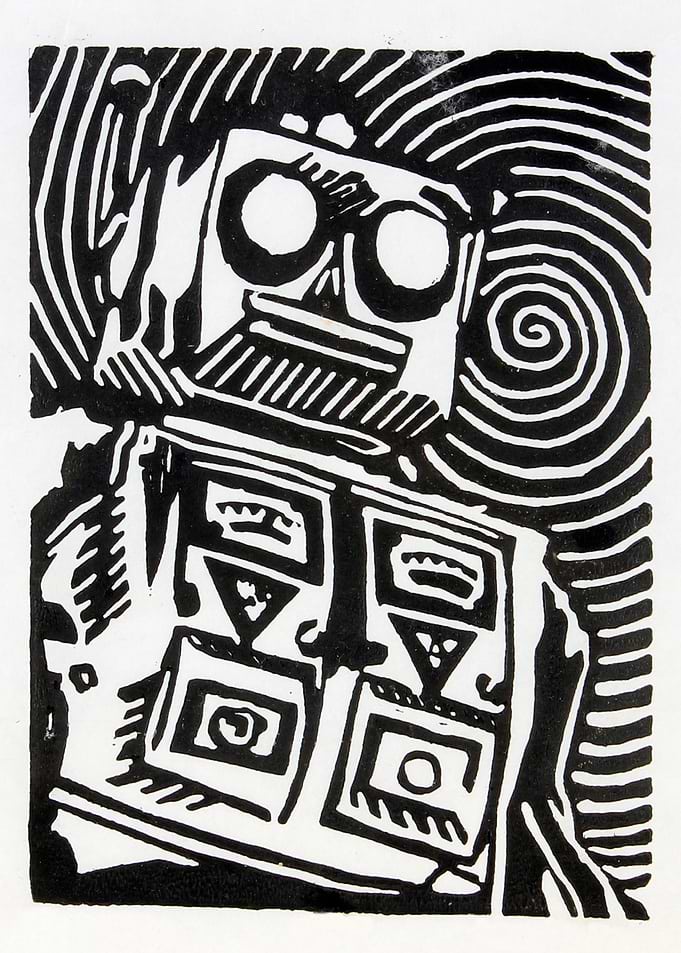 Mr. Roboto print plate on textured background.