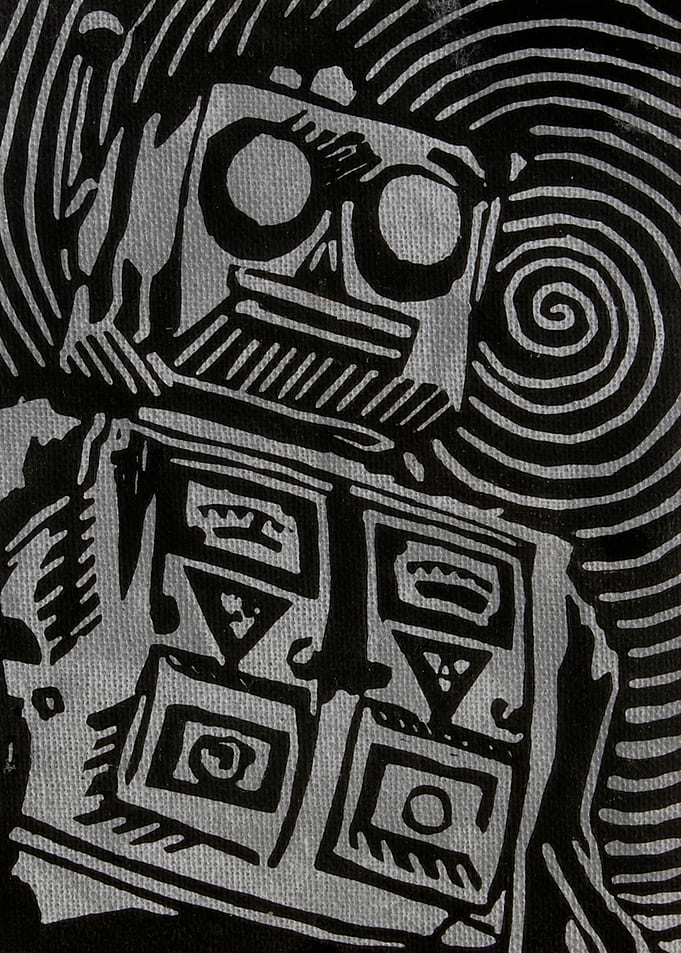 Mr. Roboto print plate on textured background.