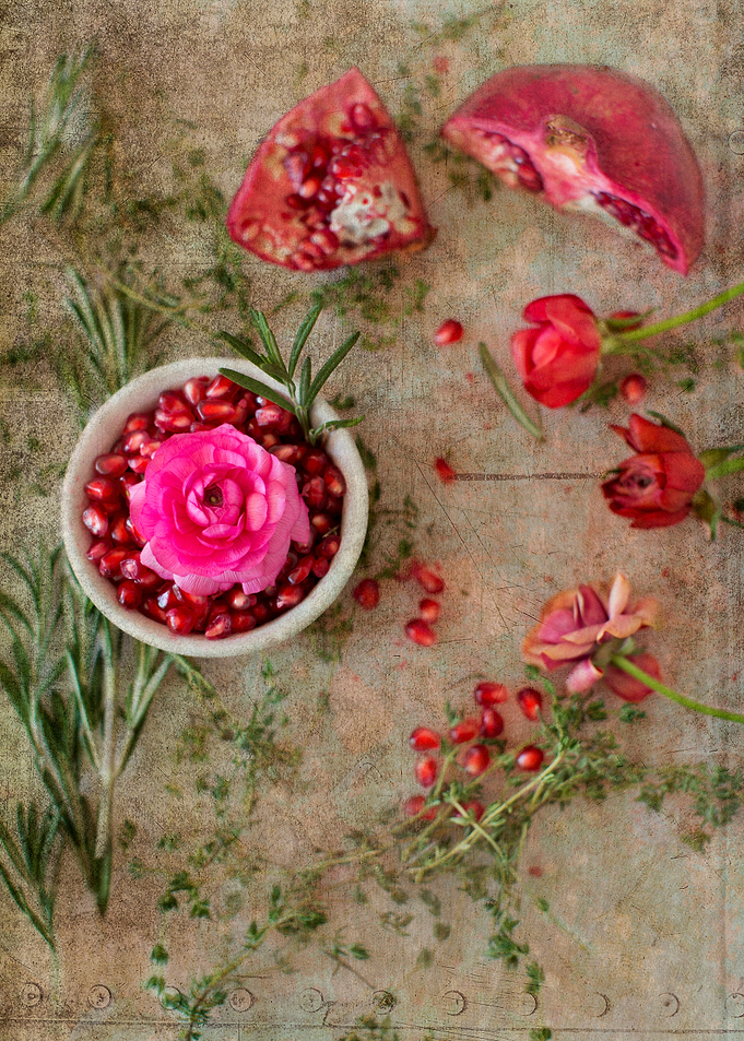 Taken from above, a view of freshly cut Pomegranate wit ...