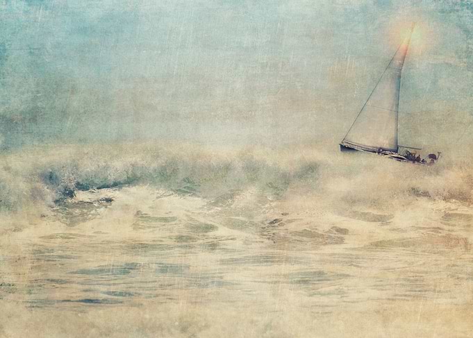 Textured for painterly effect, a lone sailboat sails po ...