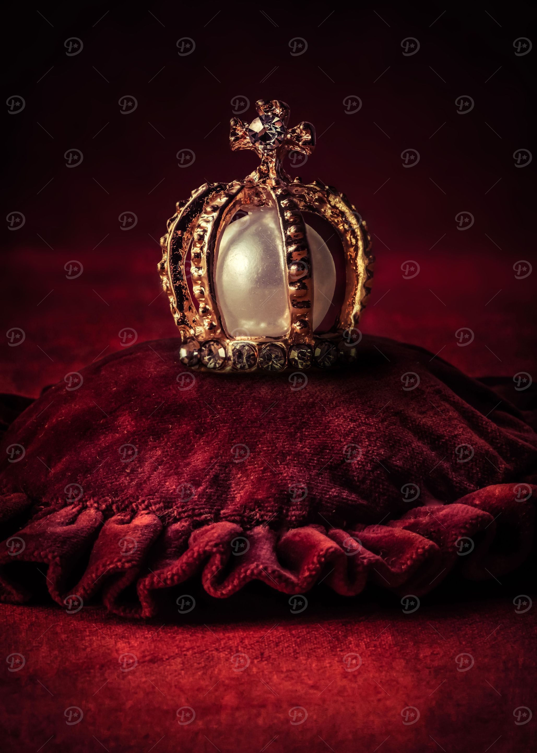 Golden crown an a red pillow