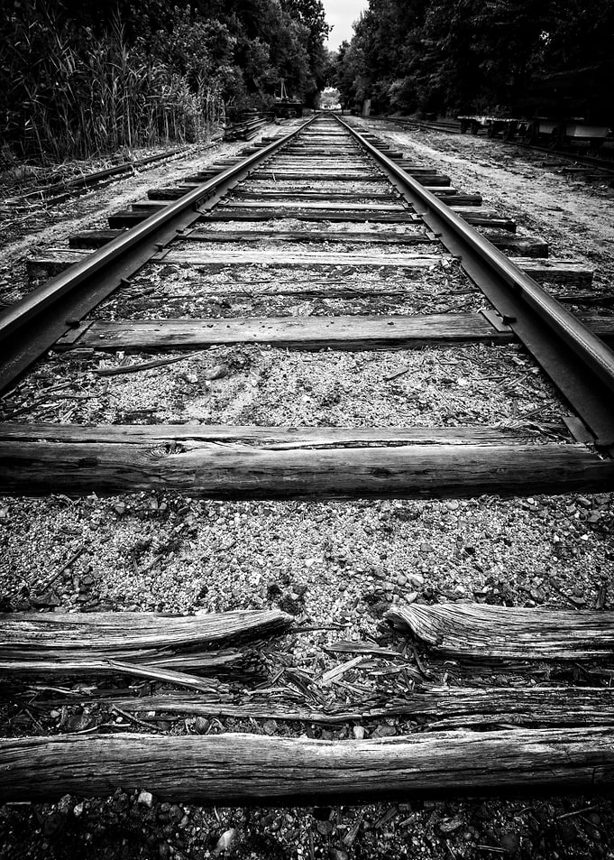 Old worn train tracks vanishing in the distance. Fine ...