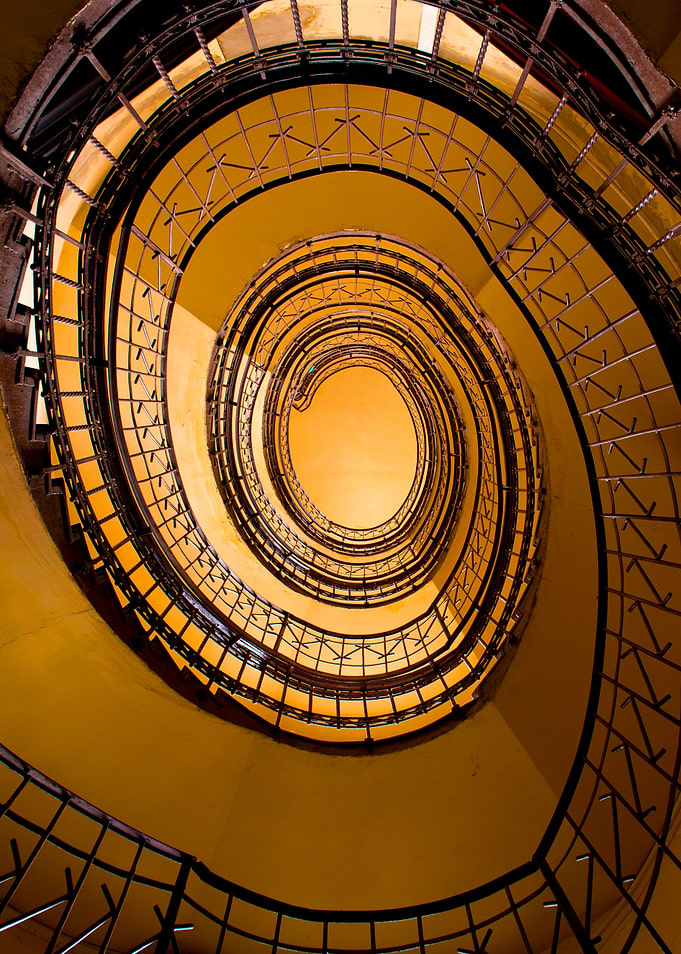 Spiral staircase in brown and orange tones