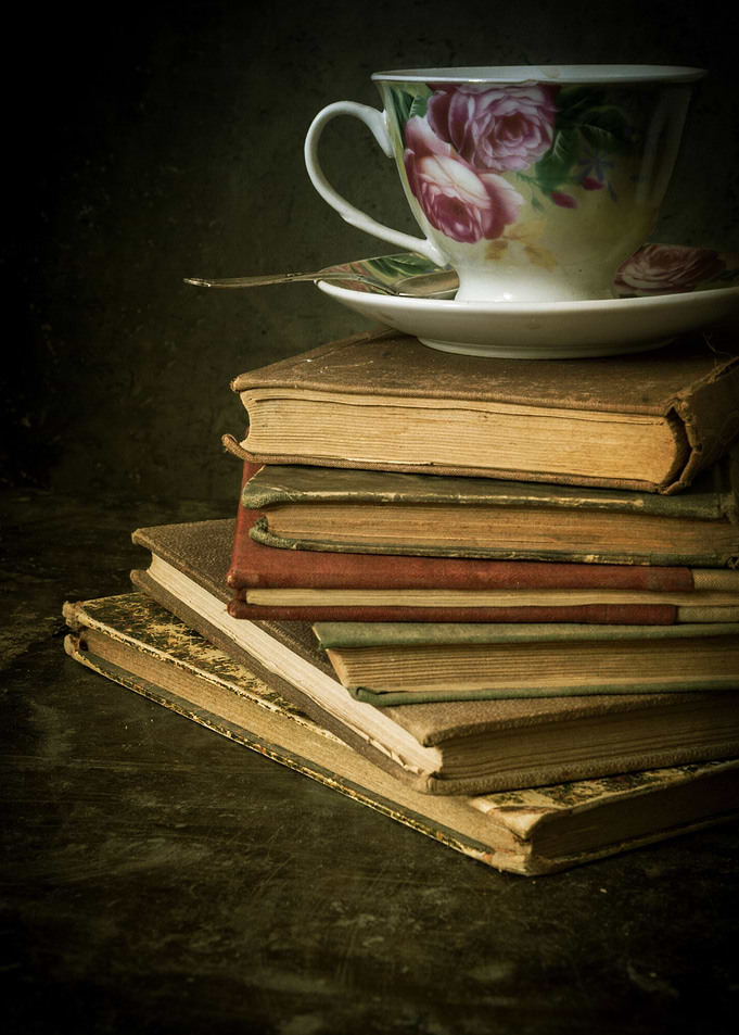 Still life with teacup and pile of books