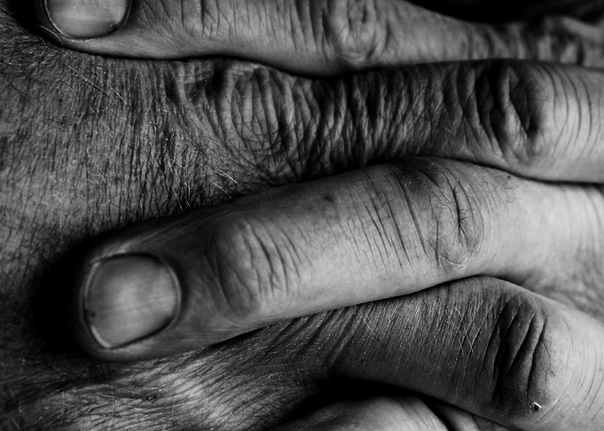 Fingers The hands of a working man relaxed and contente ...