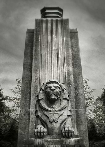 Sentinel. One of the two twin Lion statues at the entra ...