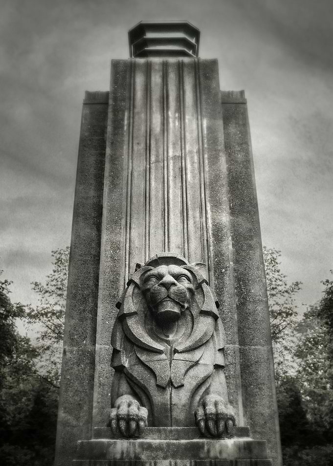 Sentinel. One of the two twin Lion statues at the entra ...