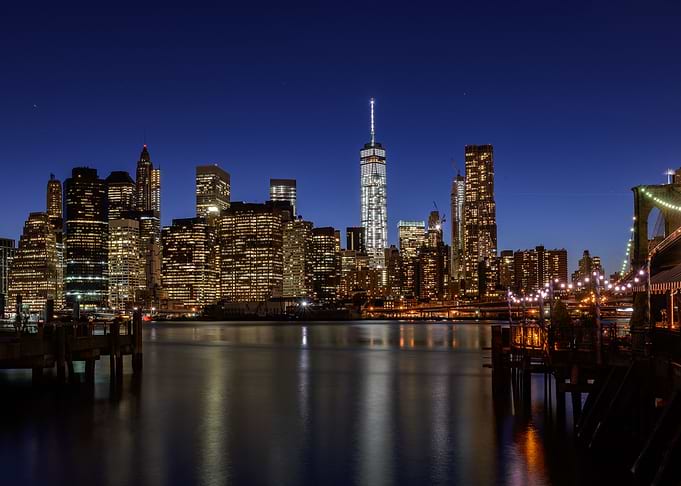 Twilight in lower manhattan, the Freedom Tower is light ...