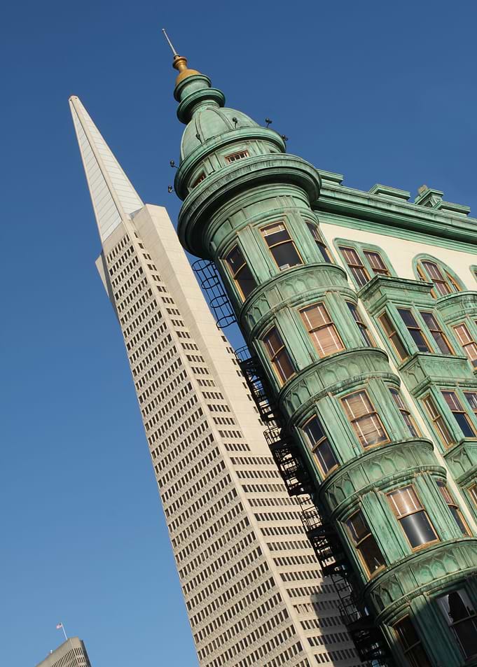 Old and New And old building next to a new building in ...