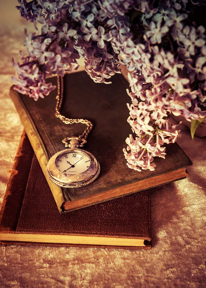 Still life with two books and old style pocket watch
