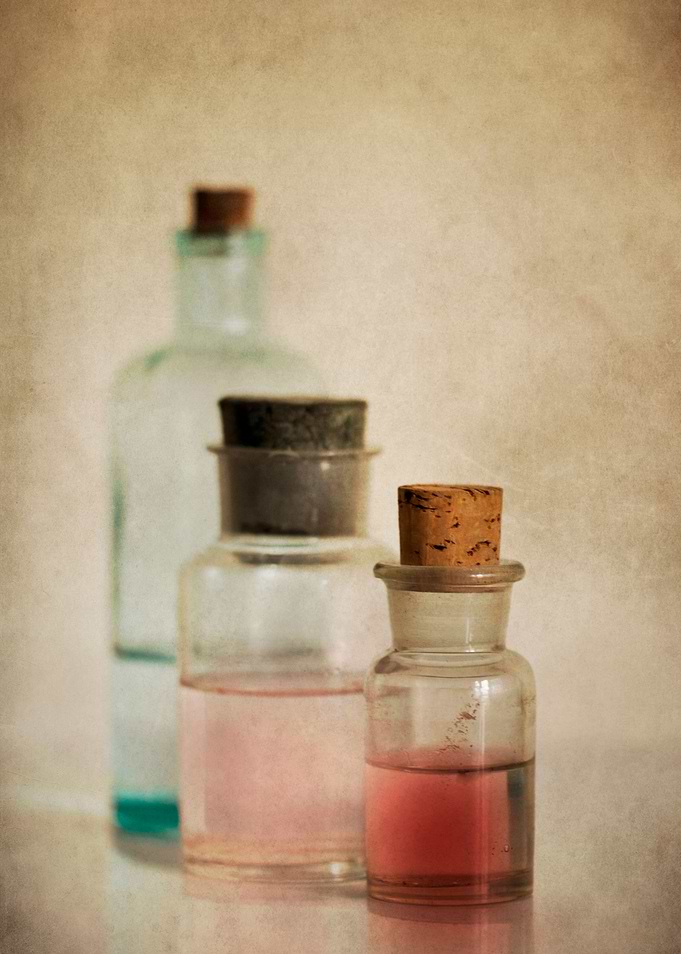 Still life with three glass bottles