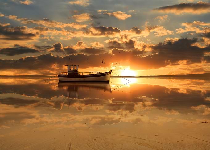 The fishing boat in the sunset