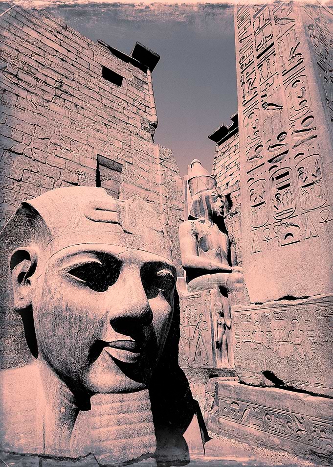 the gateway to Luxor temple Egypt with colossi of Ramse ...