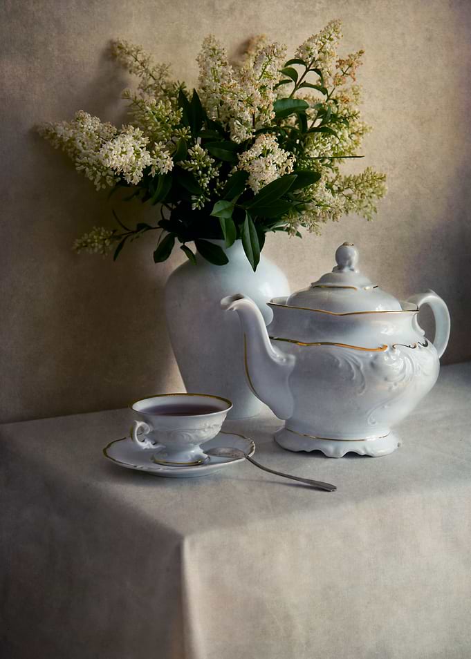Still life with white tea set and fresh white flowers