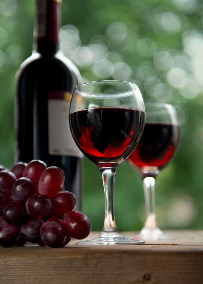 Still life with red wine and grapes