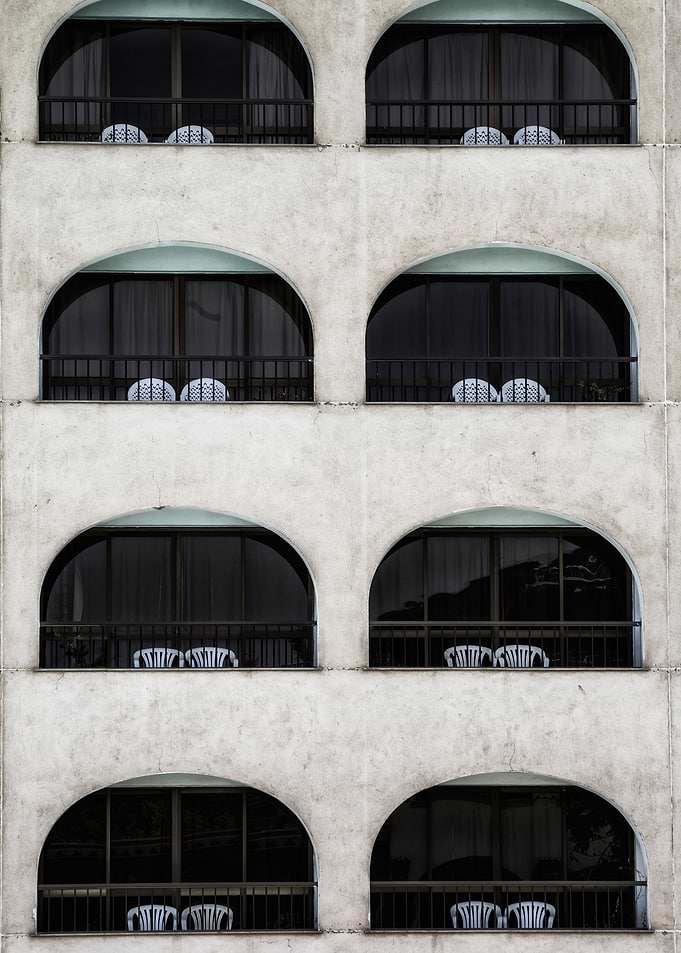 balconies with two chairs each