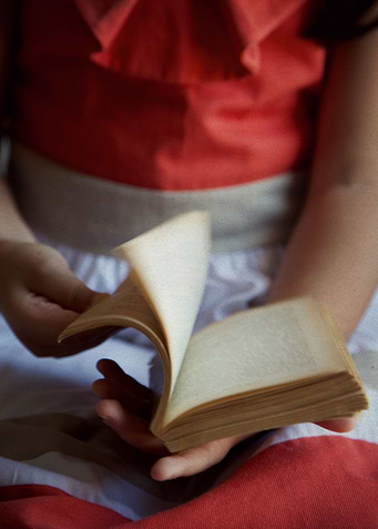 Child with a book in hands