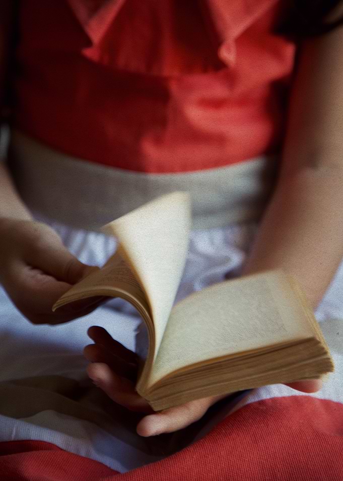 Child with a book in hands