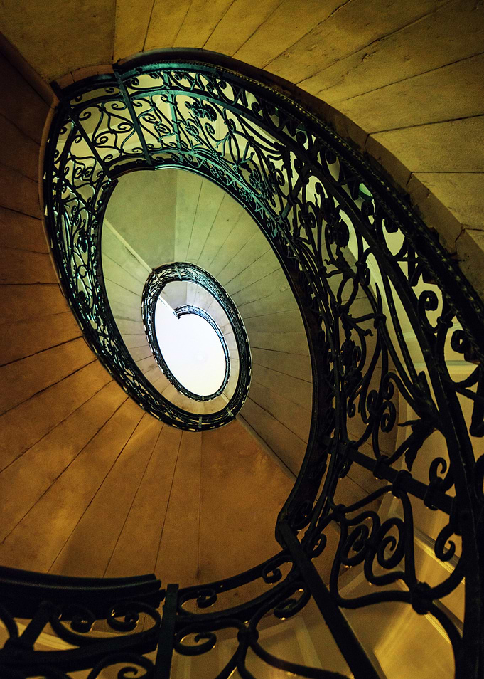 Old ornamented staircase in brown and green tones