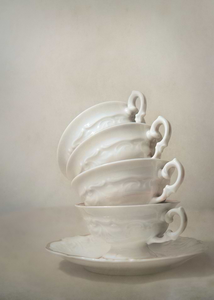 Set of four white china teacups