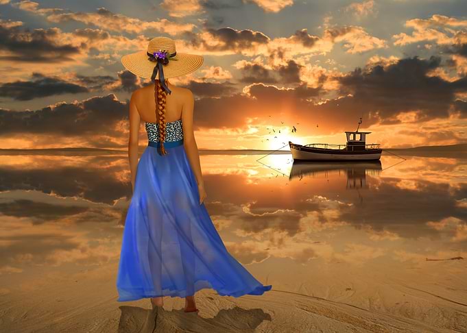 Romantic motif with woman in long dress at the sea at s ...
