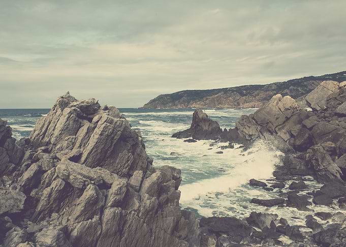 'Sea as far as you can see' A rocky beach.