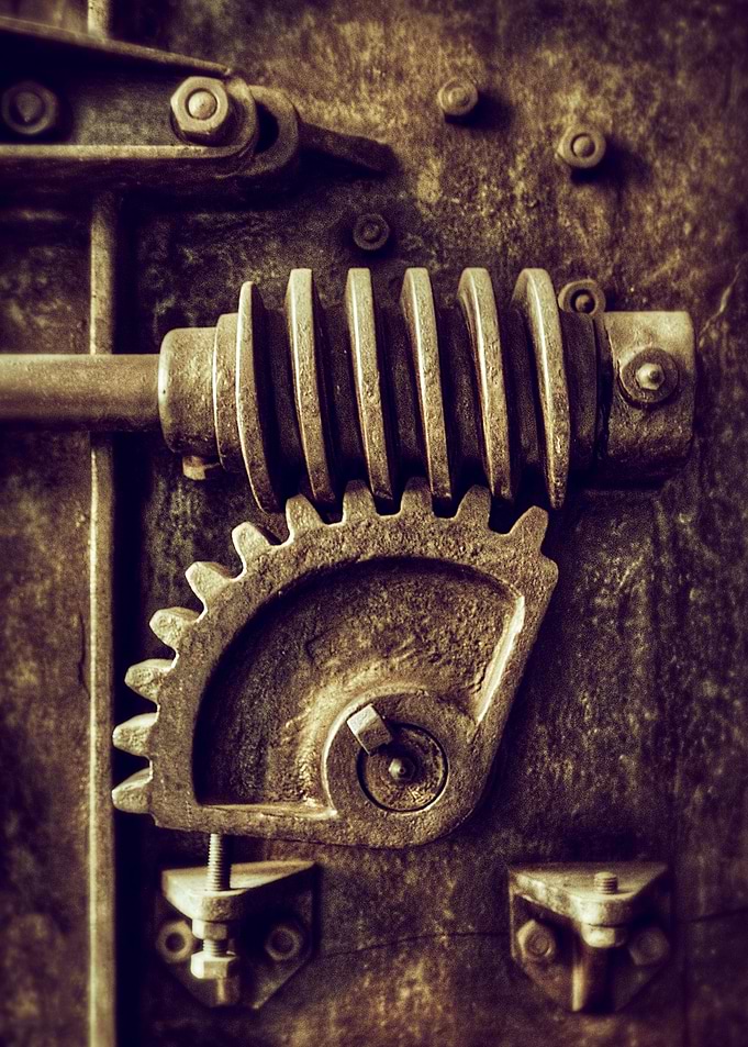 Industrial detail of an old heavy iron machine with spr ...