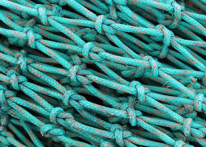 Turquoise fishing nets used for catching crabs in the w ...