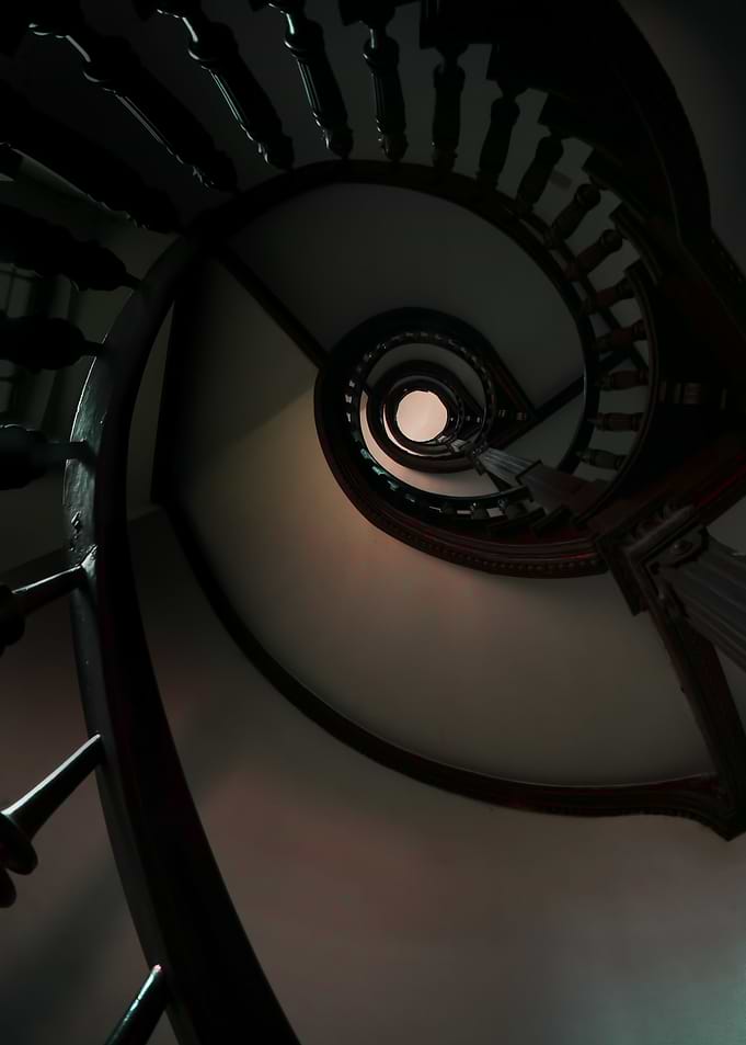 Wooden spiral staircaise. View from the bottom