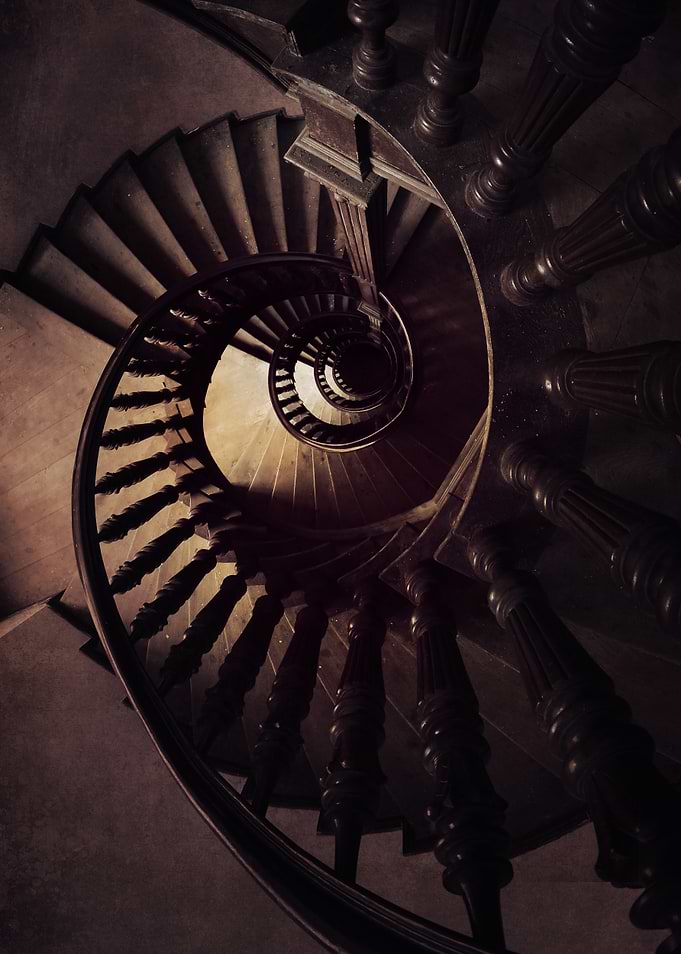 Wooden spiral staircase in brown tones