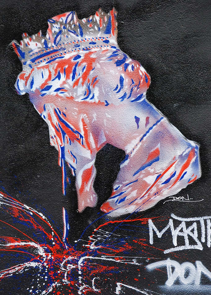 This image was painted on a wall in London of the queen ...