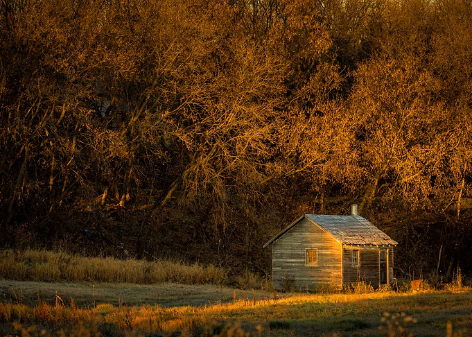 Old house in sun rays