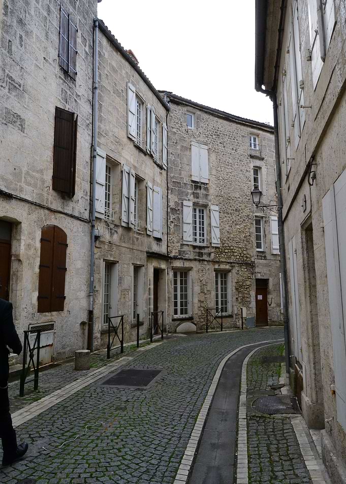 A rainy day in an old street with traditional architect ...