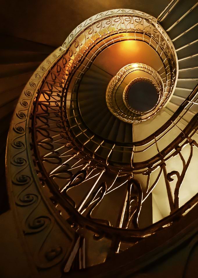 Spiral stairs in golden tones