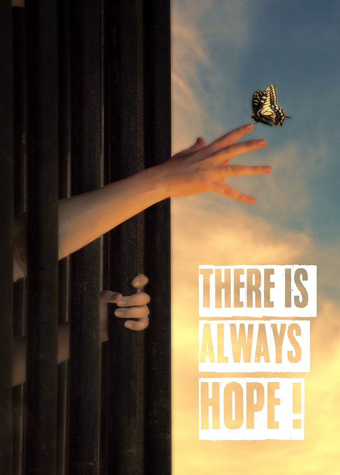 Hand reaching through bars towards a beautiful butterfl ...