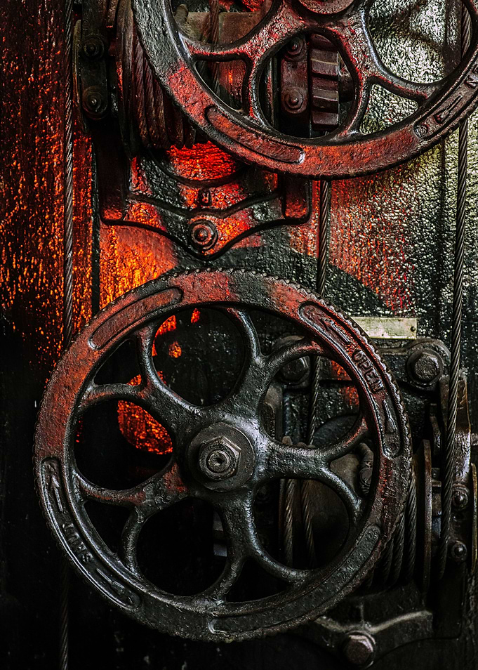 Detail of old and heavy industrial machine wheel with s ...