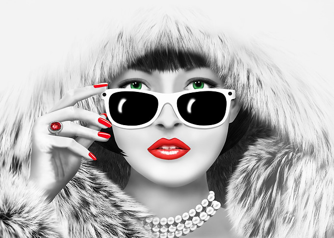 Portrait of a beautiful woman in a fur coat. Black and ...